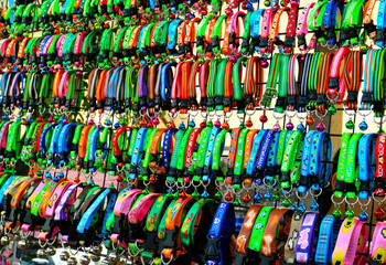 Fototapeta na wymiar multicolor pet collars for sale at pet shop in Thailand