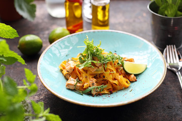 Tagliatelle with grilled salmon in a cream sauce with the addition of white wine
