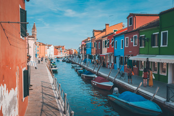 Fototapeta na wymiar Canal street in Murano Italy with boats