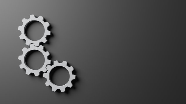 3D computer generated image of three connecting gear on dark gray background, copy space, wallpaper design