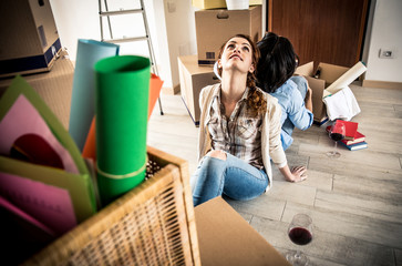 Young couple moving in into new apartment