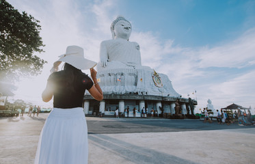 Beautiful thai girl visiting the big buddha in Phuket