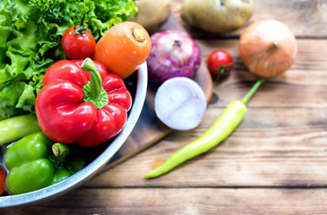 Fototapeta na wymiar Fresh organic vegetables for cooking salad. diet and healthy food. Fall harvest cornucopia season.