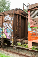 Vienna, Austria-September 06,2012:.old  rusty wagon with graffiti standing abandoned on in track