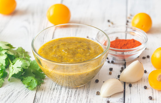 Bowl of tkemali with the ingredients