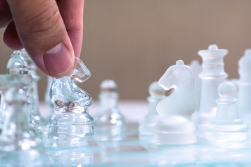 Chess board game made of glass, business competitive concept