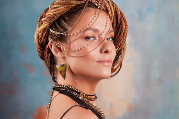 Southern flavor. Close-up portrait of a young, gorgeous, fatal beauty with an afro braid hairstyle.