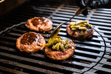 chef making grilled cutlets for burgers