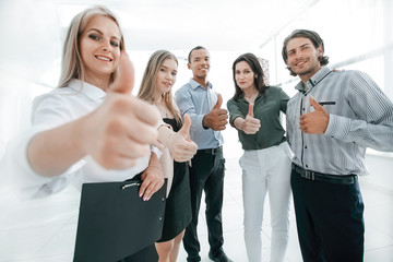 successful multinational business team showing thumb up