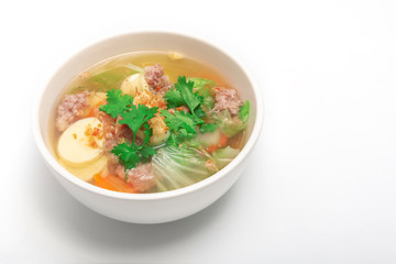 Pork Chops and tofu soup on white bowl on whitebackground