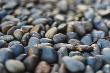 Fototapeta na wymiar Close up of pebble stones on the pavement
