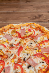 Pepperoni Pizza with Mozzarella cheese, Ham, Tomatoes, pepper, Spices . Italian pizza.