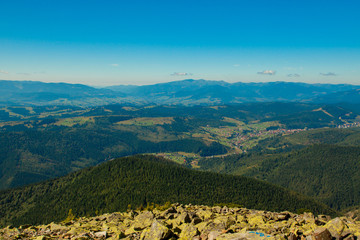Fototapeta premium Beautiful mountain landscape, with mountain peaks covered with forest and a cloudy sky. Ukraine mountains, Europe