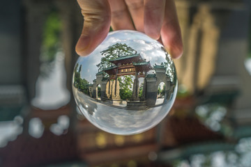 Glass Ball and Chinese traditional architecture at Zhongshan park. Foshan city, Guangdon province, China