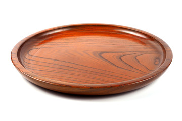 Empty round wood plate on white background, brown wooden dish