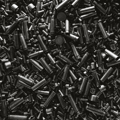 Different size bullet shells on the black ground. War concept. production of ammunition at the...