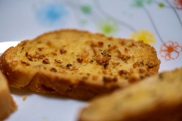 homemade garlic bread in white plate, Sensitive Focus