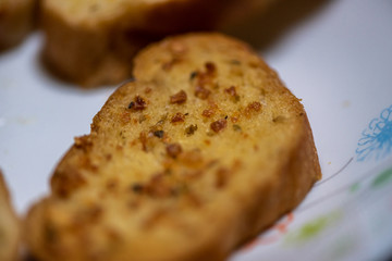homemade garlic bread in white plate, Sensitive Focus
