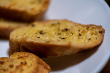 homemade garlic bread in white plate, Sensitive Focus