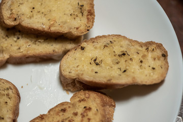 homemade garlic bread in white plate, Sensitive Focus