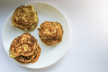 Pancakes on a white plate