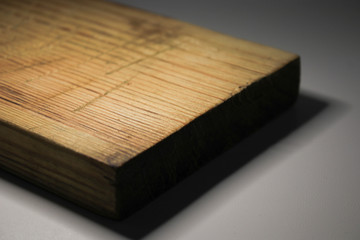 Wooden board on a gray background