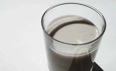 Glass of yogurt on the windowsill