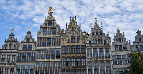 Fototapeta na wymiar Old historic houses in Antwerp Belgium With golden statues.
