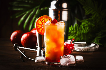 Tequila sunrise alcoholic cocktail with silver tequila, grenadine syrup, orange and ice cubes....