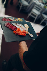 Catering and haute cuisine concept. Snacks, waiter, food.