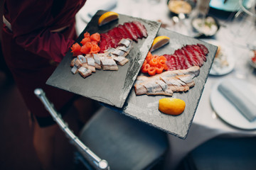 Catering and haute cuisine concept. Snacks, waiter, food.