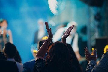 Woman claps at a concert. Applause concept.