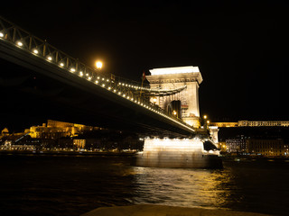 The Széchenyi Chain Bridge is a suspension bridge that spans the River Danube between Buda and Pest, the western and eastern sides of Budapest, the capital of Hungary.