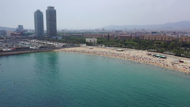 BARCELONA, SPAIN - JULY 07, 2019: Scenic view from drone of seaside area of Barcelona on sunny summer day, Catalonia 