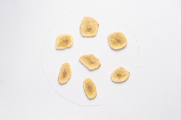Banana chips isolated on white backgroud.
