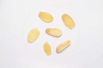 Candied ginger pieces isolated on white backgroud.