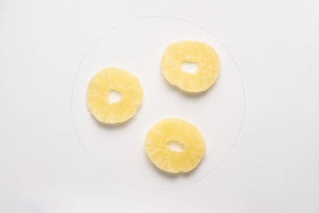 Candied pineapple round chips isolated on white backgroud.
