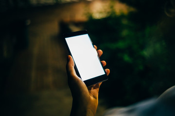 Young woman using mobile device outdoors
