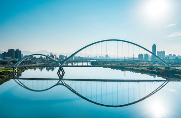 Crescent Bridge - landmark of New Taipei, Taiwan with beautiful illumination at day, aerial photography in New Taipei, Taiwan.