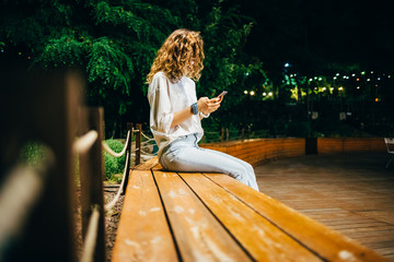 Unrecognizable young woman wearing white shirt