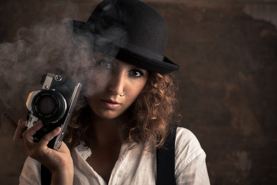 Woman Photographer with Bowler and Suspenders Holding a Cigar