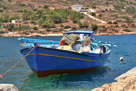 Chios, Greece, Limenas Meston harbour, blue fishing boat.