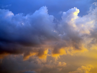 Obraz premium Cumulus rain clouds on a blue sky. Weather forecast. Rain and thunder