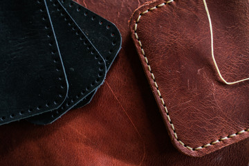 Leather working tool on genuine leather background