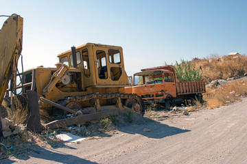 Fototapeta na wymiar A wrecked construction machines in the island of Patmos, Greece