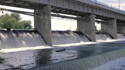 Water rushing through gates at a dam