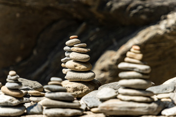 Fototapeta na wymiar Close-up of a pile of stones in balance, Zen concept. Vernazza, Liguria, Italy