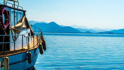 a boat on a lake with Mountain View background