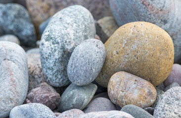 Detail of rounded and weathered granite stones found at the shore of Sweden