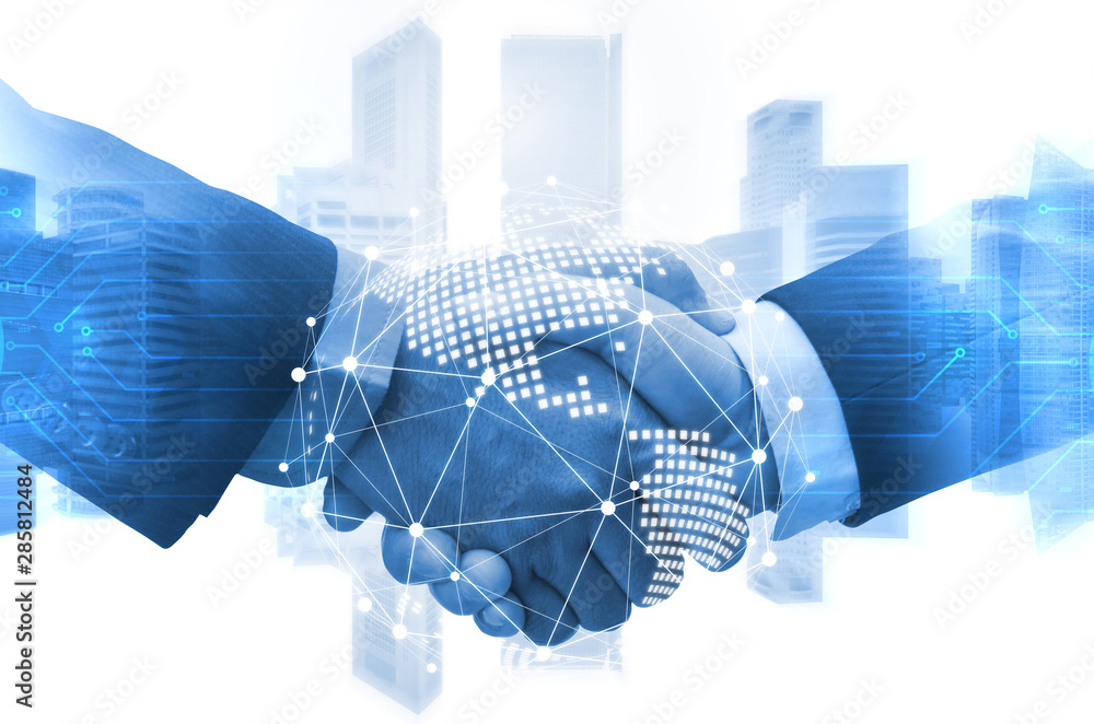 Wall mural deal. business man shaking hands with effect world map global and network link connection graphic di